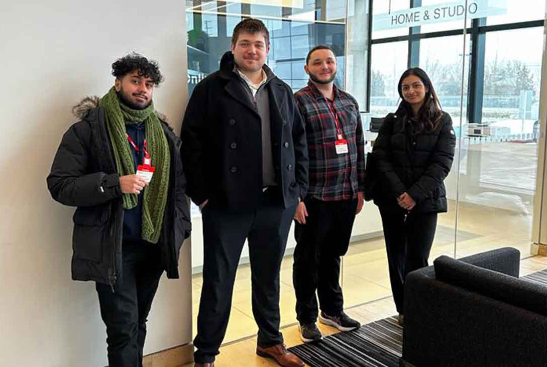 Four students posing for a photo at the Brampton printing studios