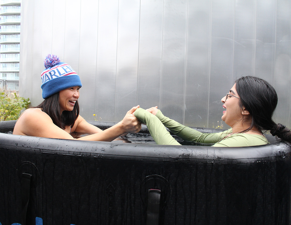 Dr. Choi (left) with student in a tub with ice